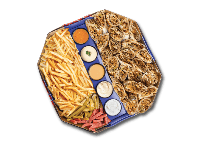 Shawarma tray served with rice, pita chips, parsley and sauces